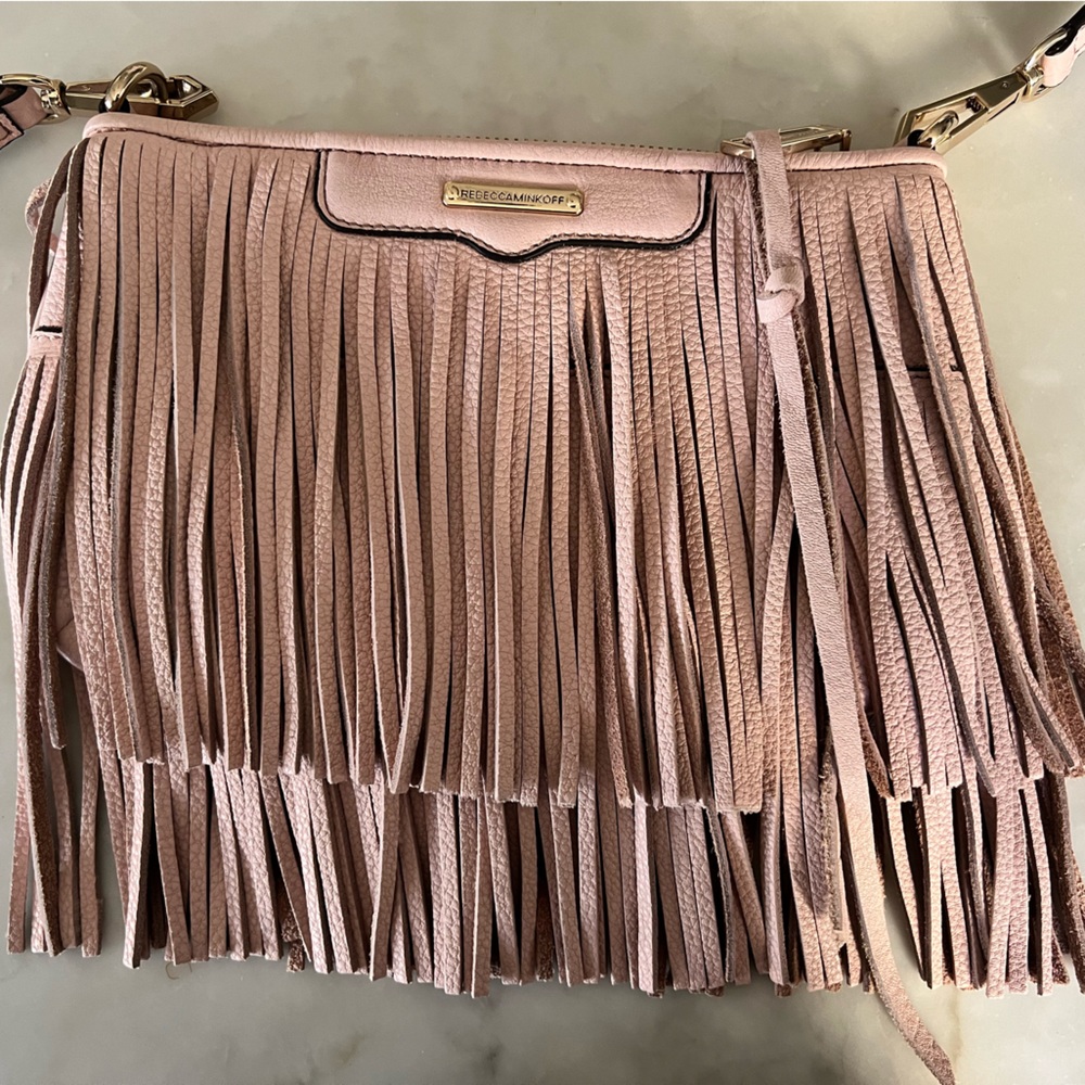 Rebecca Minkoff baby pink fringed crossbody bag.
